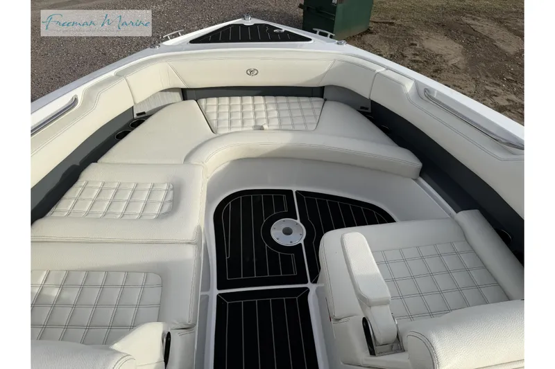 Slide: The Image of Luxurious interior of a 2021 Cobalt R30 boat with white cushioned seating. - 30