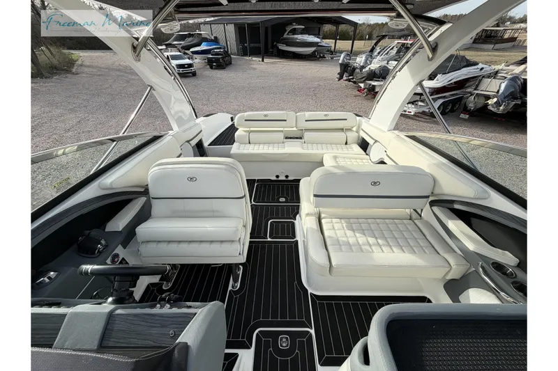 Slide: The Image of 2021 Cobalt R30 boat interior with luxurious white seating and sleek design. - 34