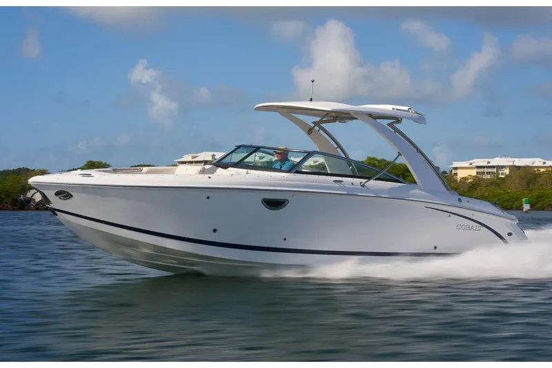 Slide: The Image of Manufacturer Provided Image: 2021 Cobalt R30 boat cruising on water with scenic background. - 38