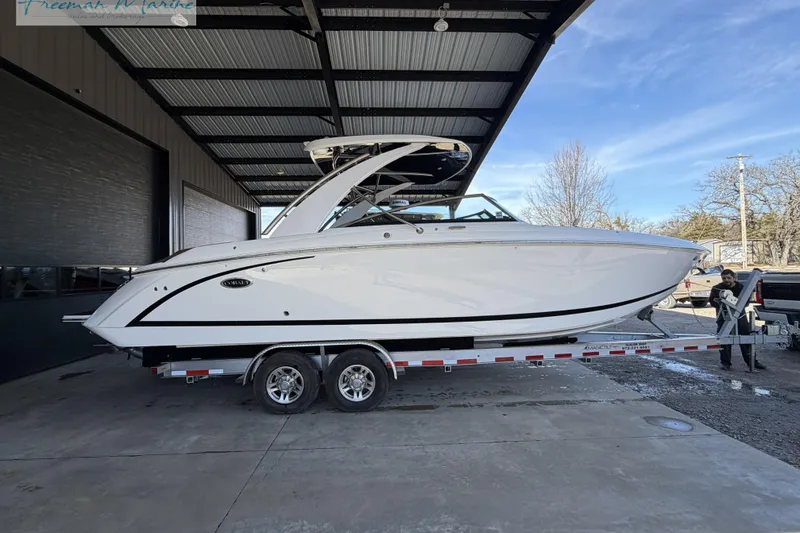 Slide: The Image of 2021 Cobalt R30 boat on trailer under metal canopy, side view. - 5