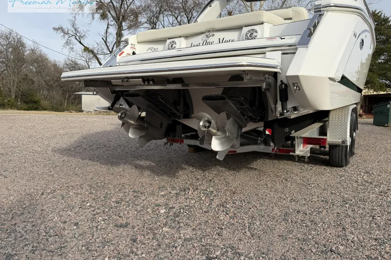 Slide: The Image of 2021 Cobalt R30 boat on trailer, showcasing dual propellers and sleek design. - 9