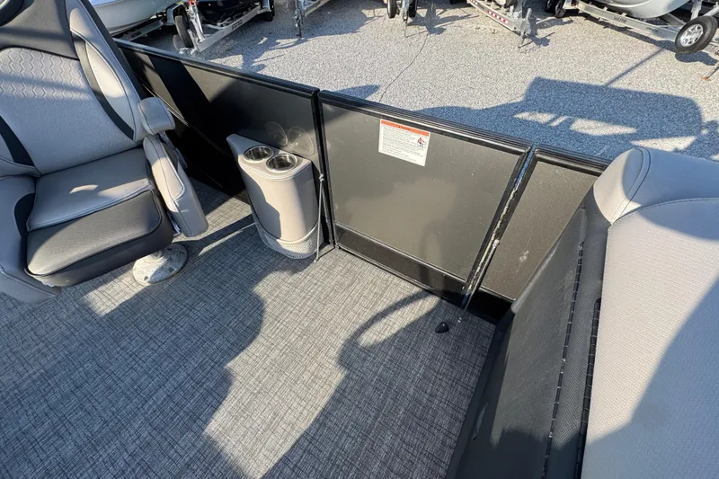 Slide: The Image of Interior of a 2018 South Bay 725RS boat with seating and cup holders. - 21