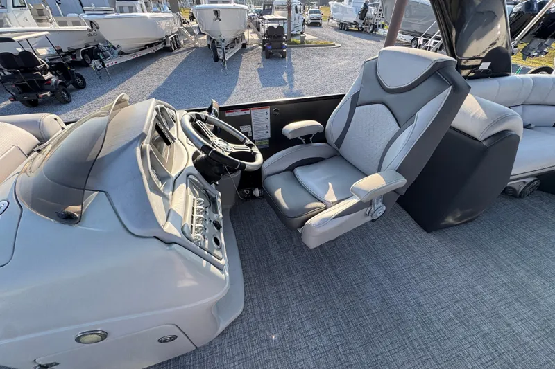 Slide: The Image of Interior of 2018 South Bay 725RS boat with steering console and captain's chair. - 22