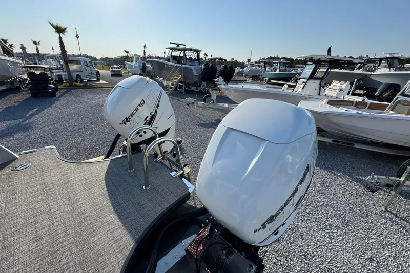 Slide: The Image of 2018 South Bay 725RS boat with twin Racing 400R outboard motors at a marina. - 31