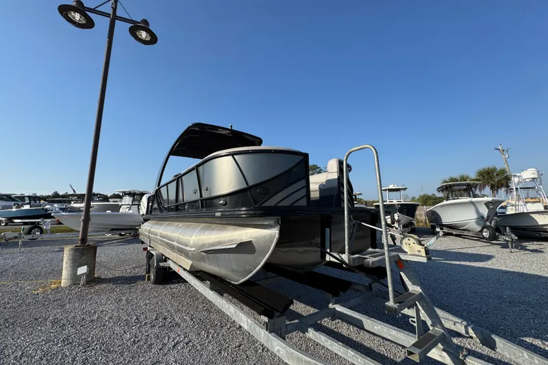 Slide: The Image of 2018 South Bay 725RS pontoon boat on trailer under clear blue sky. - 7