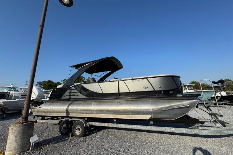 Slide: The Image of 2018 South Bay 725RS pontoon boat on trailer under clear blue sky. - 9