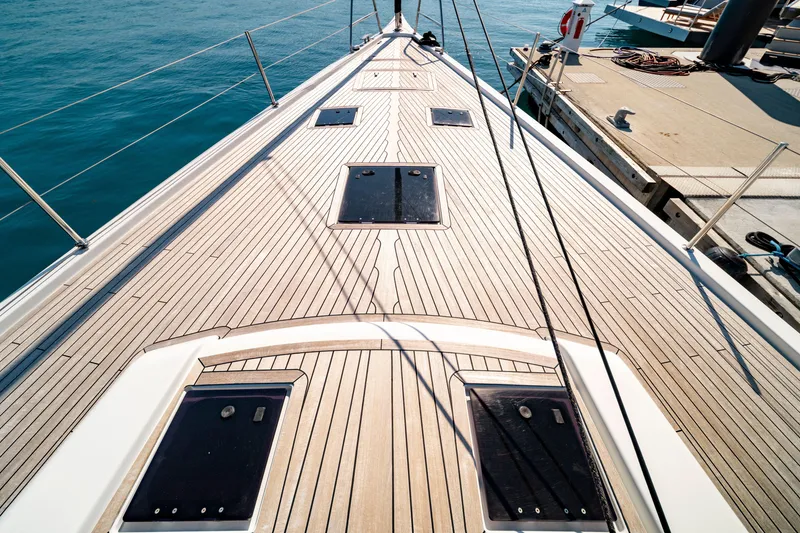 Slide: The Image of Grand Soleil 58 yacht deck, 2016 model, docked at marina with clear blue water. - 15