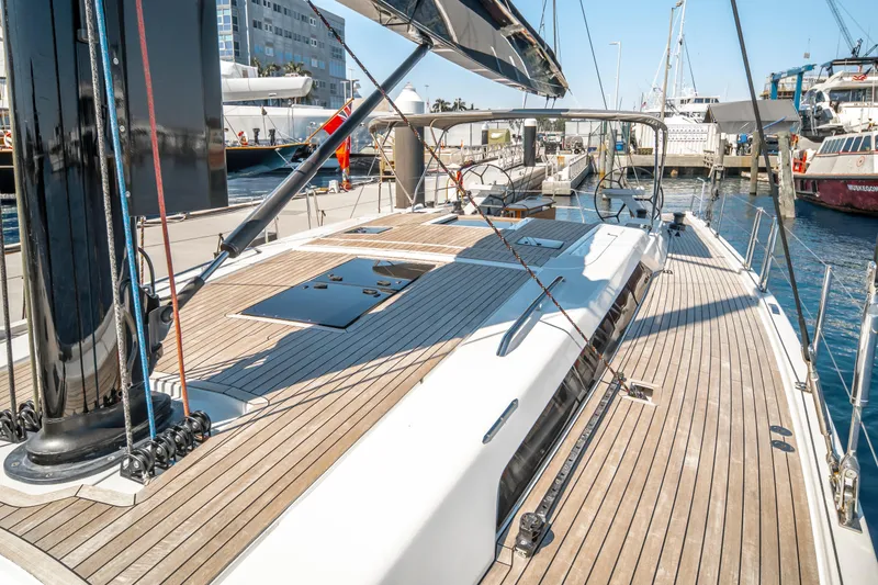 Slide: The Image of Luxurious 2016 Grand Soleil 58 yacht docked at a marina, showcasing sleek deck design. - 21