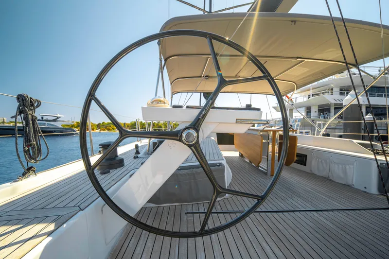 Slide: The Image of Grand Soleil 58 yacht deck with steering wheel, 2016 model, docked in marina. - 23