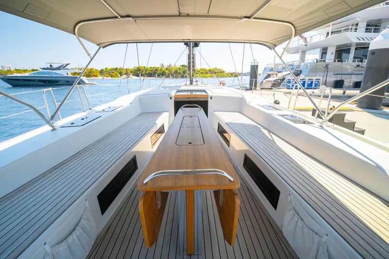 Slide: The Image of Spacious deck of 2016 Grand Soleil 58 yacht with wooden table and seating. - 28