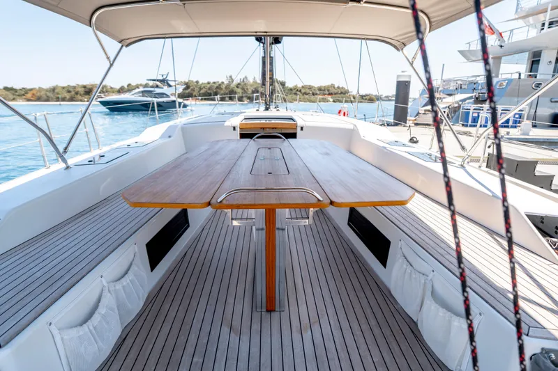 Slide: The Image of Spacious deck of 2016 Grand Soleil 58 yacht with elegant wooden table and seating. - 29