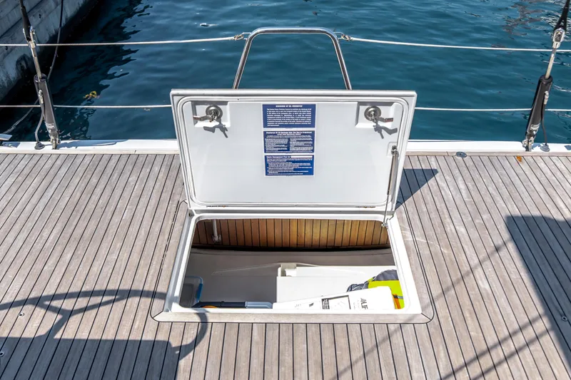 Slide: The Image of Open hatch on 2016 Grand Soleil 58 yacht deck, revealing storage compartment. - 33