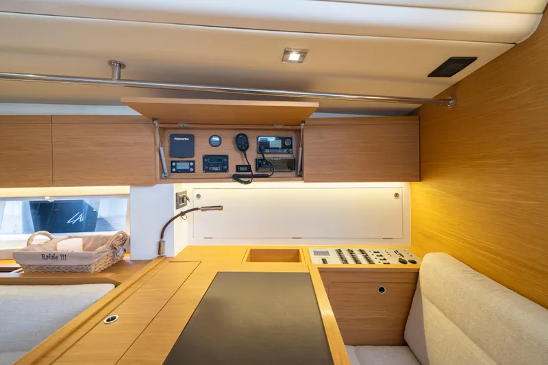 Slide: The Image of Interior of 2016 Grand Soleil 58 yacht with navigation equipment and wooden cabinetry. - 38