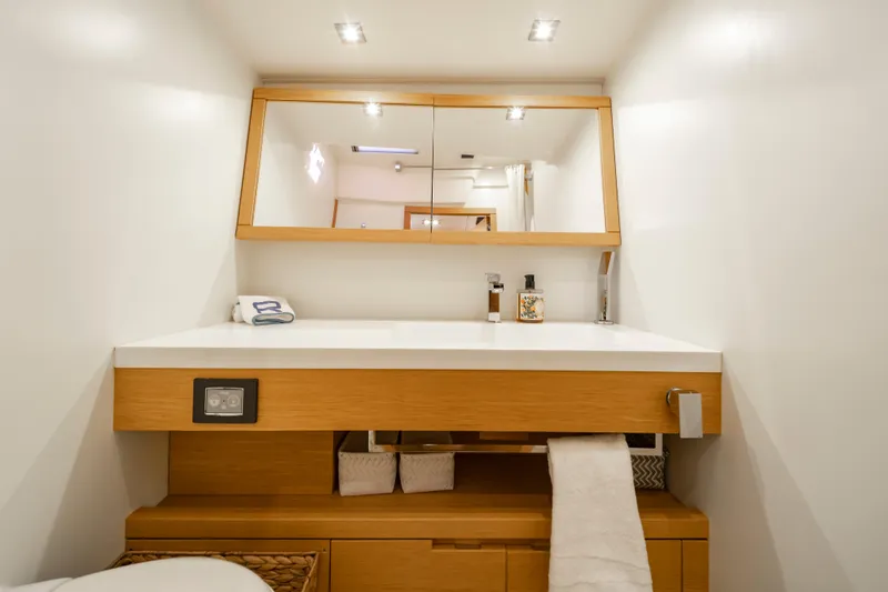 Slide: The Image of Modern bathroom vanity on 2016 Grand Soleil 58 yacht, featuring sleek design and ample storage. - 40