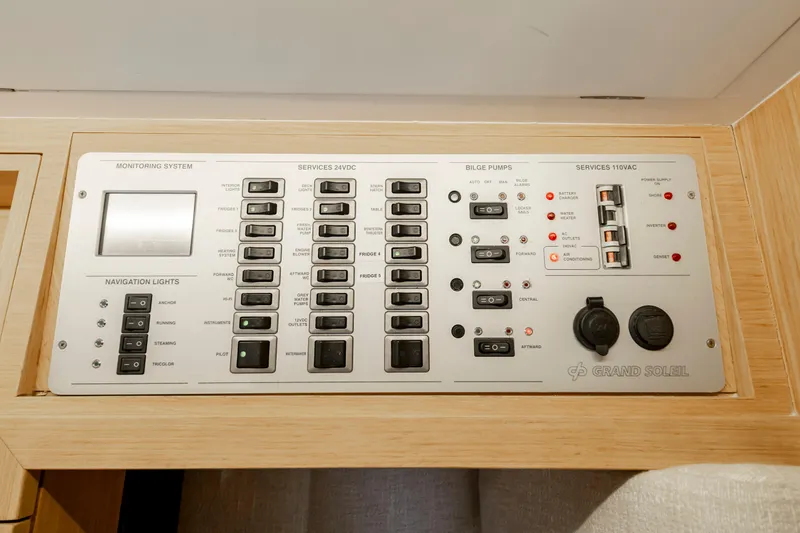 Slide: The Image of Control panel of a 2016 Grand Soleil 58 yacht, featuring navigation and monitoring systems. - 46