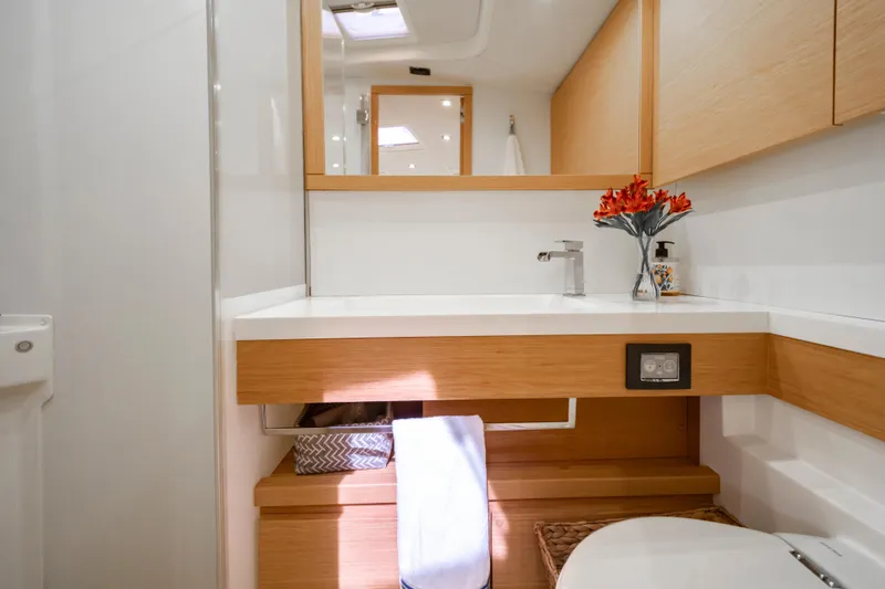 Slide: The Image of Luxurious bathroom interior of 2016 Grand Soleil 58 yacht with modern fixtures and wooden accents. - 49