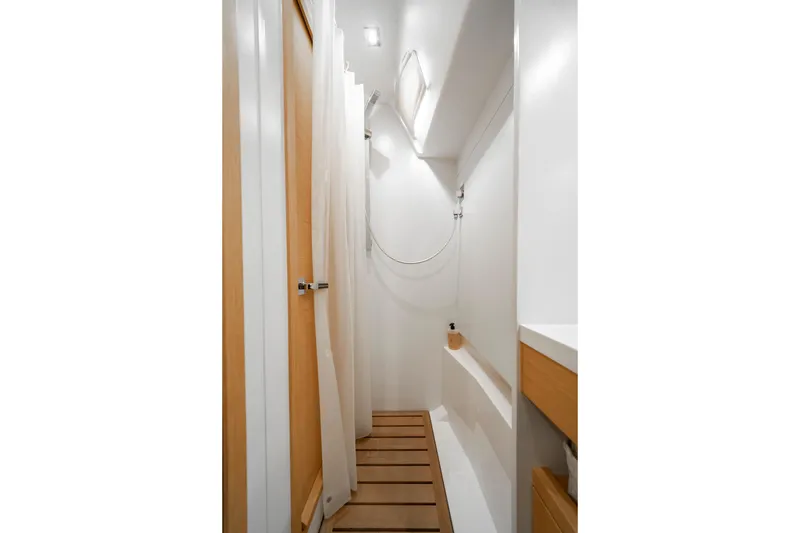 Slide: The Image of Modern bathroom interior on 2016 Grand Soleil 58 yacht, featuring wooden accents and sleek design. - 55