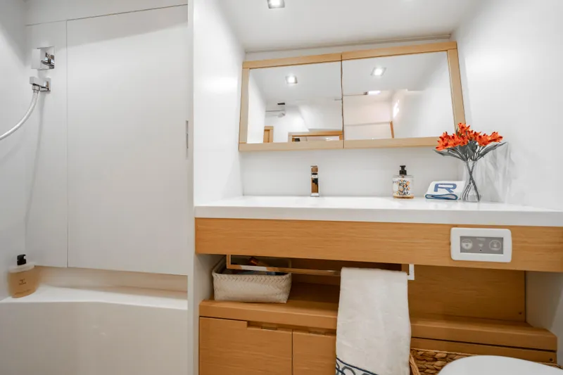 Slide: The Image of Modern bathroom interior on a 2016 Grand Soleil 58 yacht, featuring sleek design and wooden accents. - 56