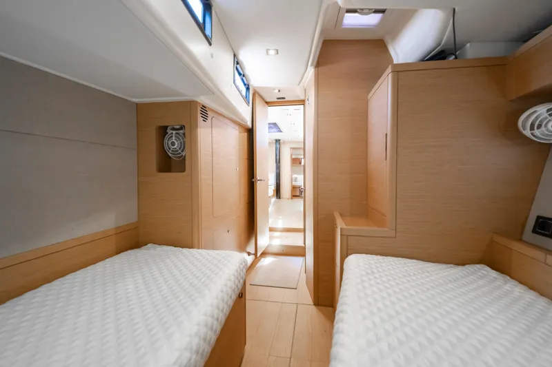 Slide: The Image of Interior of 2016 Grand Soleil 58 yacht with twin beds and wooden finish. - 58