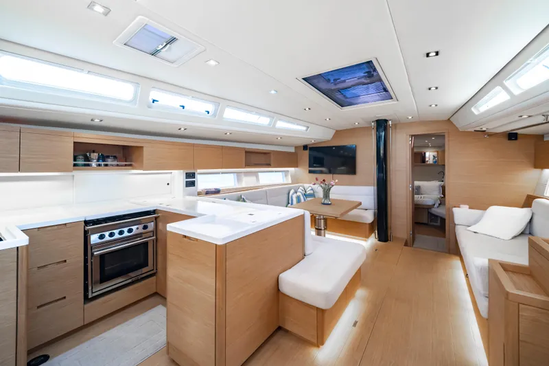 Slide: The Image of Luxurious interior of 2016 Grand Soleil 58 yacht with modern kitchen and seating area. - 59