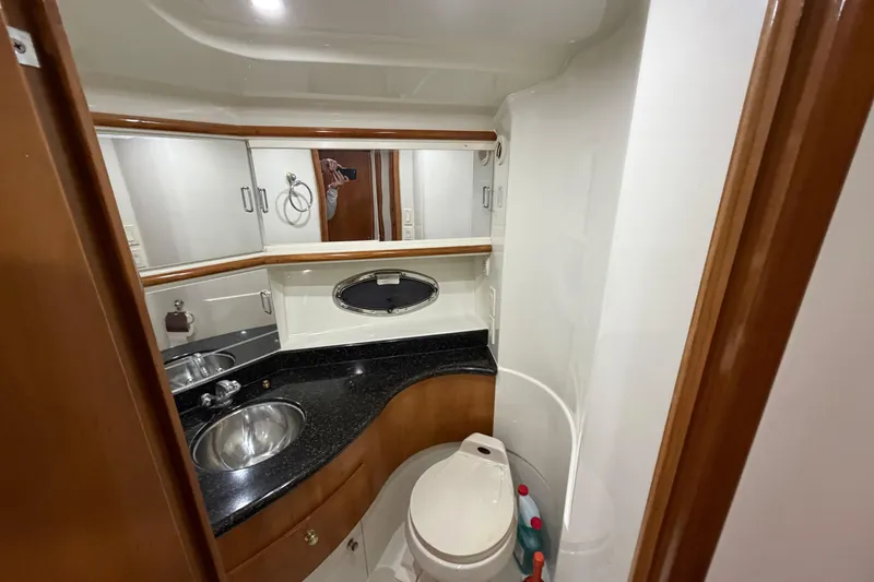 Slide: The Image of Bathroom interior of 2001 Carver 444 Cockpit Motor Yacht with sink and toilet. - 13