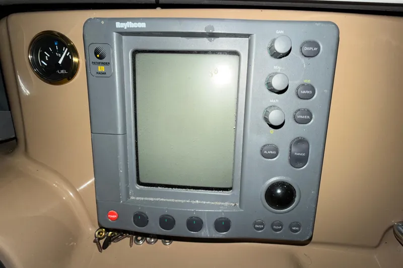 Slide: The Image of Control panel of a 2001 Carver 444 Cockpit Motor Yacht with Raytheon radar display. - 30