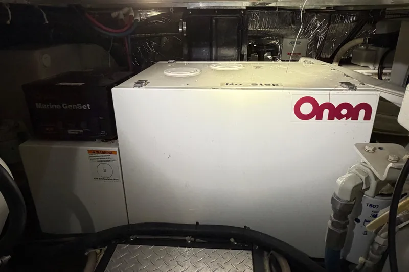 Slide: The Image of Engine room of 2001 Carver 444 Cockpit Motor Yacht with Onan generator. - 34