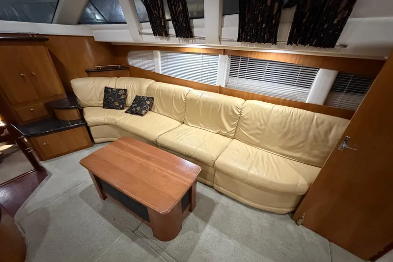 Slide: The Image of Luxurious interior of 2001 Carver 444 Cockpit Motor Yacht with beige leather seating. - 4