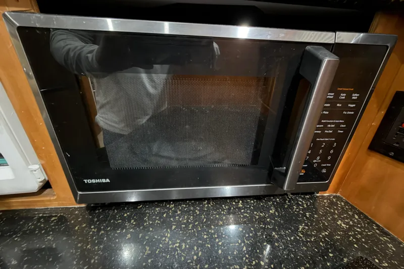 Slide: The Image of Toshiba microwave in a 2001 Carver 444 Cockpit Motor Yacht kitchen. - 9