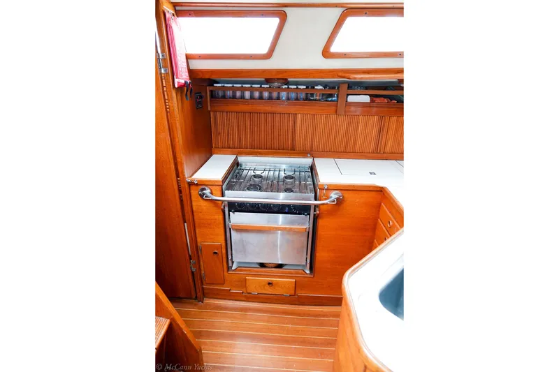Slide: The Image of Interior of 1987 Sabre 42 yacht kitchen with stove and wooden cabinetry. - 15
