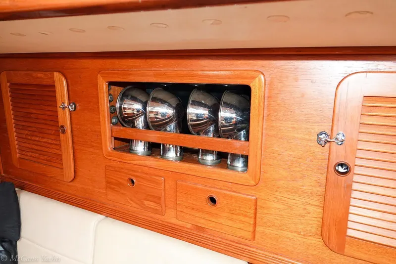 Slide: The Image of Wooden interior of 1987 Sabre 42 yacht with polished metal fixtures. - 18