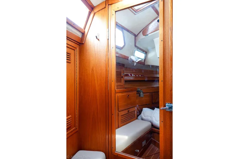 Slide: The Image of Interior of 1987 Sabre 42 sailboat cabin with wooden finish and cozy seating. - 19
