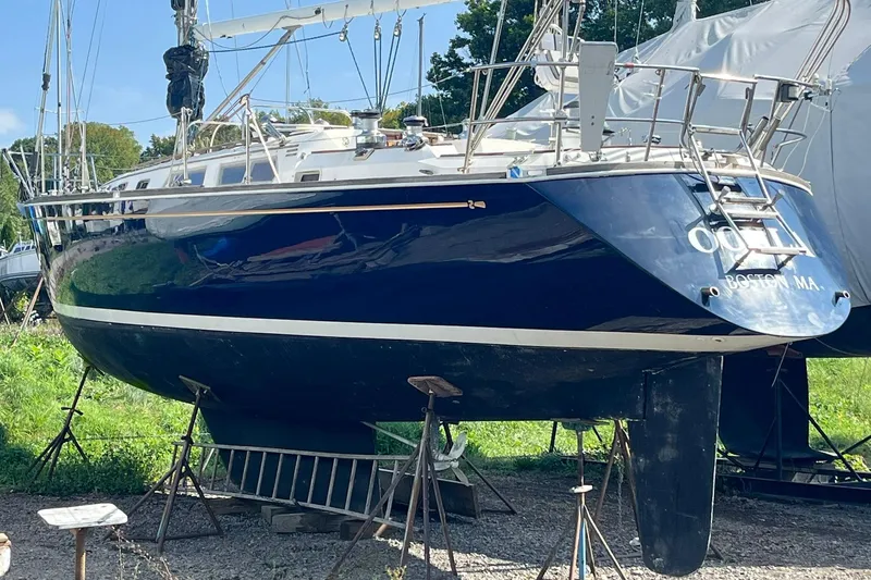 Slide: The Image of 1987 Sabre 42 sailboat on stands, blue hull, located in Boston, MA. - 26