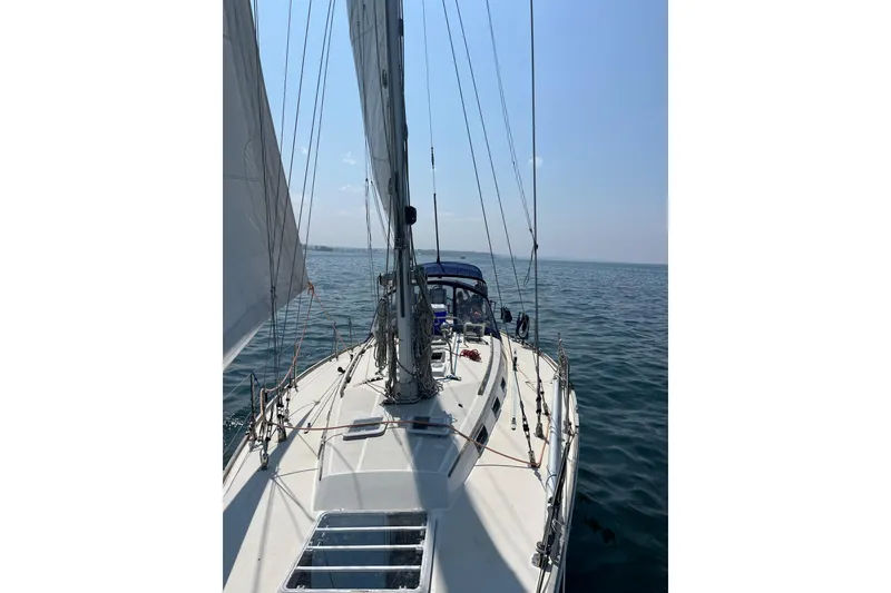 Slide: The Image of Sailing on a 1987 Sabre 42 yacht in open waters under clear skies. - 4