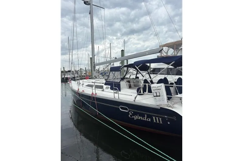 The Image of 2002 Catalina 400 MkII sailboat docked at marina under cloudy sky. - 0