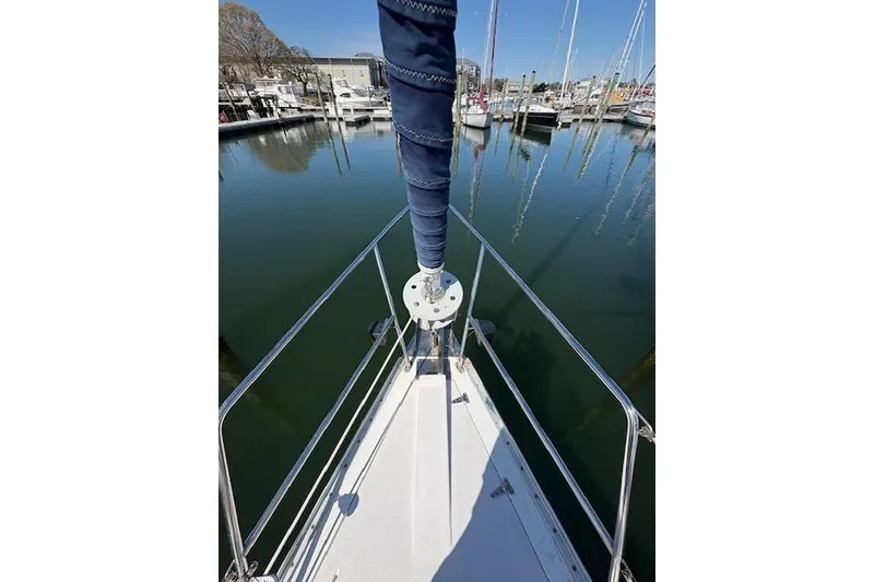 Slide: The Image of Bow view of 2002 Catalina 400 MkII sailboat docked in a marina. - 17