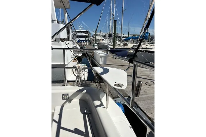 Slide: The Image of Catalina 400 MkII 2002 sailboat docked at marina with clear blue sky. - 22