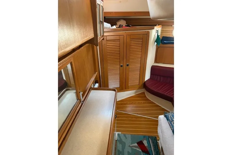 Slide: The Image of Interior of 2002 Catalina 400 MkII sailboat with wooden cabinetry and seating. - 23