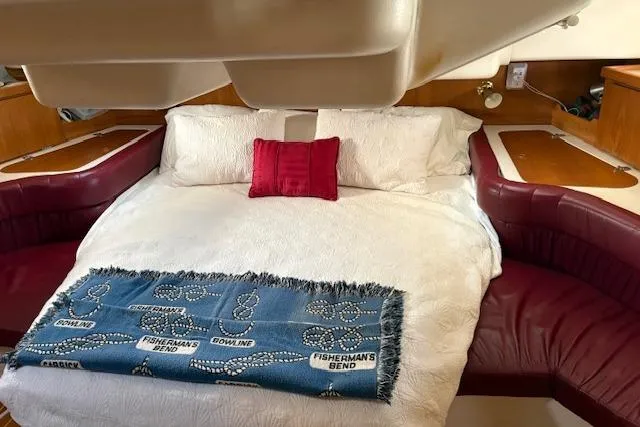 Slide: The Image of Luxurious cabin interior of a 2002 Catalina 400 MkII yacht with cozy bedding. - 24