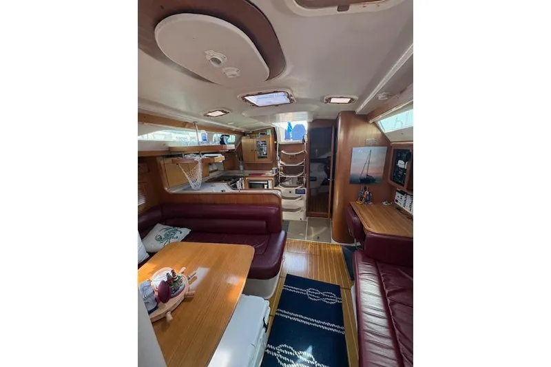 Slide: The Image of Interior of 2002 Catalina 400 MkII sailboat with wood finish and seating area. - 28