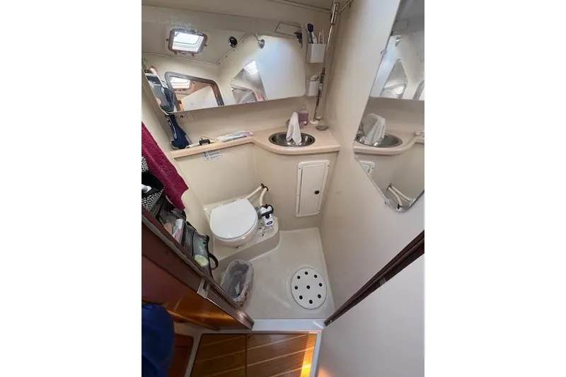 Slide: The Image of Bathroom interior of 2002 Catalina 400 MkII sailboat, featuring toilet and sink. - 30
