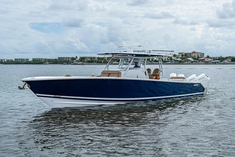 Slide: The Image of 2024 Jupiter 43 boat on water, sleek design, blue hull, modern features. - 19