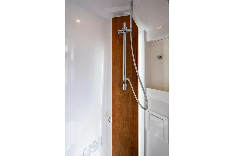 Slide: The Image of Modern shower area in 2024 Jupiter 43 yacht, featuring sleek design and wood accents. - 25