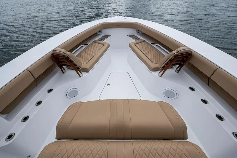Slide: The Image of Luxurious seating on 2024 Jupiter 43 boat, featuring tan cushions and sleek design. - 35