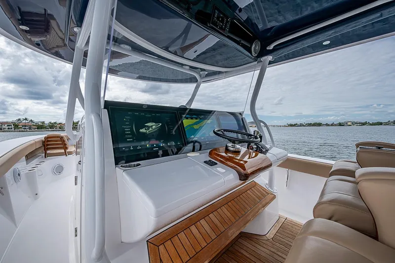 Slide: The Image of Luxurious 2024 Jupiter 43 boat helm with advanced navigation system and plush seating. - 44