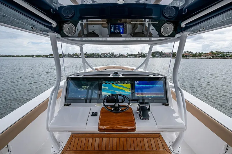 Slide: The Image of Cockpit view of 2024 Jupiter 43 boat with advanced navigation displays. - 47