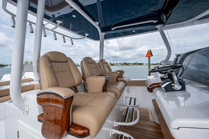 Slide: The Image of Luxurious seating on 2024 Jupiter 43 boat, featuring elegant design and advanced controls. - 49