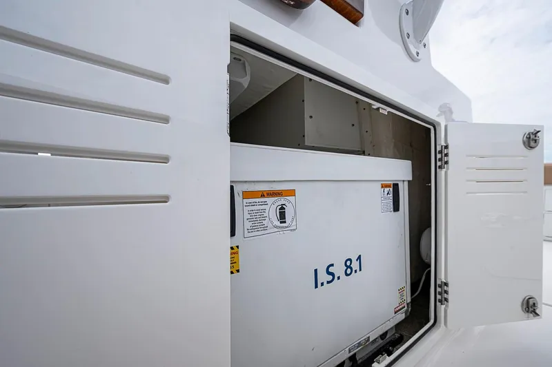 Slide: The Image of Open compartment on 2024 Jupiter 43 boat showing I.S. 8.1 unit. - 52