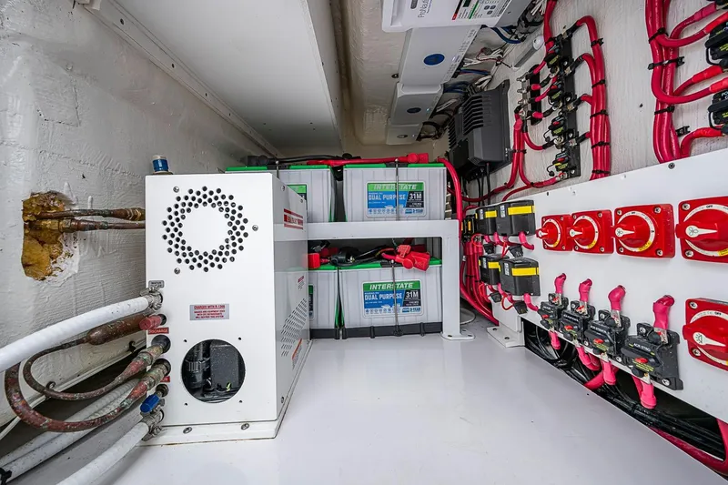 Slide: The Image of Electrical system setup in a 2024 Jupiter 43, featuring batteries and wiring components. - 53