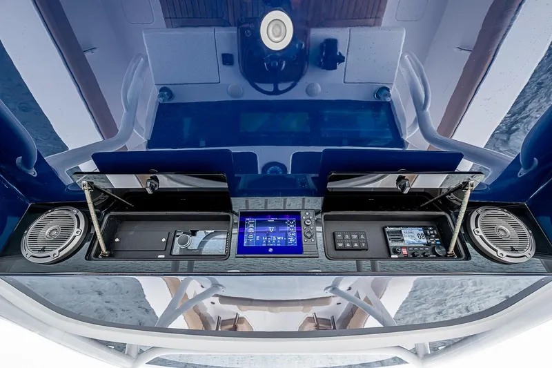 Slide: The Image of 2024 Jupiter 43 boat dashboard with advanced controls and speakers. - 54